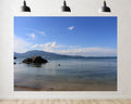 Trykid 20x10ft Tranquil Coastal Cove Backdrop Clear Turquoise Water Rocky Outcrop Distant Mountain Range White Clouds Photography Background Beach Party Decoration Photo Booth Prop Fabric