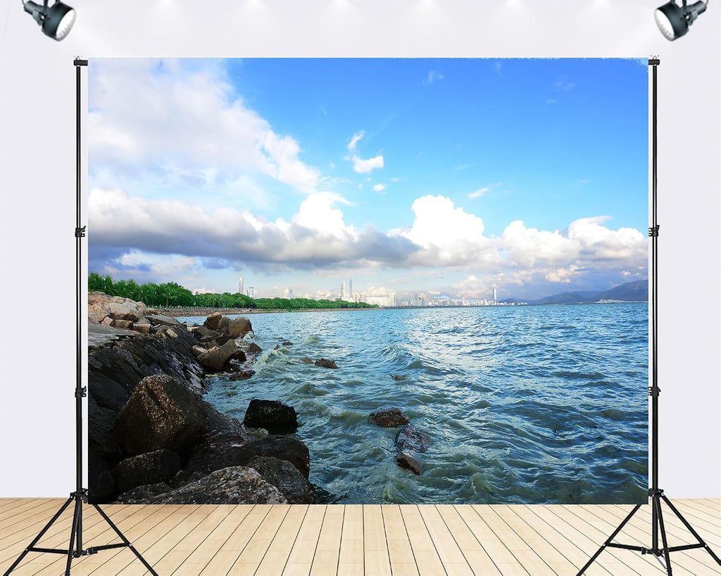 Trykid 20x10ft Tranquil Blue Coastal City Skyline Backdrop Scenic Sea View Rocky Shore Clear Blue Sky Photography Background City Themed Party Decoration Photo Booth Prop Fabric