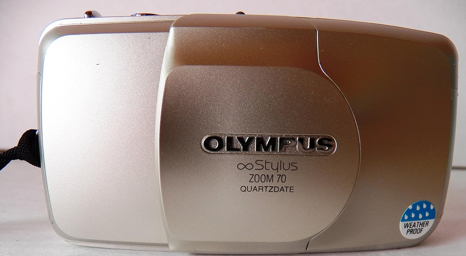 Olympus Infinity Stylus Zoom 70 Point and Shoot 35MM Camera with 35-70mm Lens, Built-in Flash, Auto Film Loader and Counter. Pocket Size.