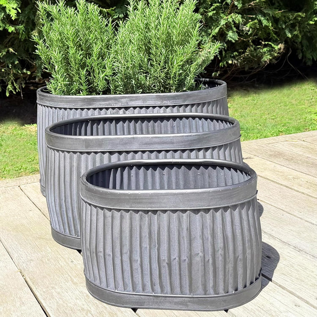WHW Whole House Worlds French Country Style Oval Belly Planters, Set of 3, Galvanized Metal, Chubby, Corrugated Cache Pots, Rustic, Over 2 Ft Long (24 1/2, 20 and 14 1/2 Inches)