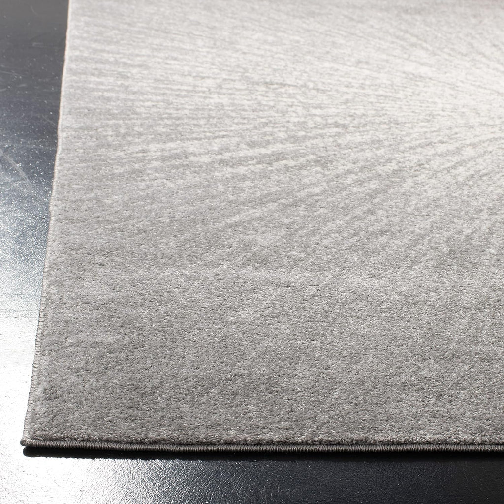 SAFAVIEH Evoke Collection Area Rug - 9' x 12', Dark Grey & Ivory, Abstract Burst Design, Non-Shedding & Easy Care, Ideal for High Traffic Areas in Living Room, Bedroom (EVK228H)