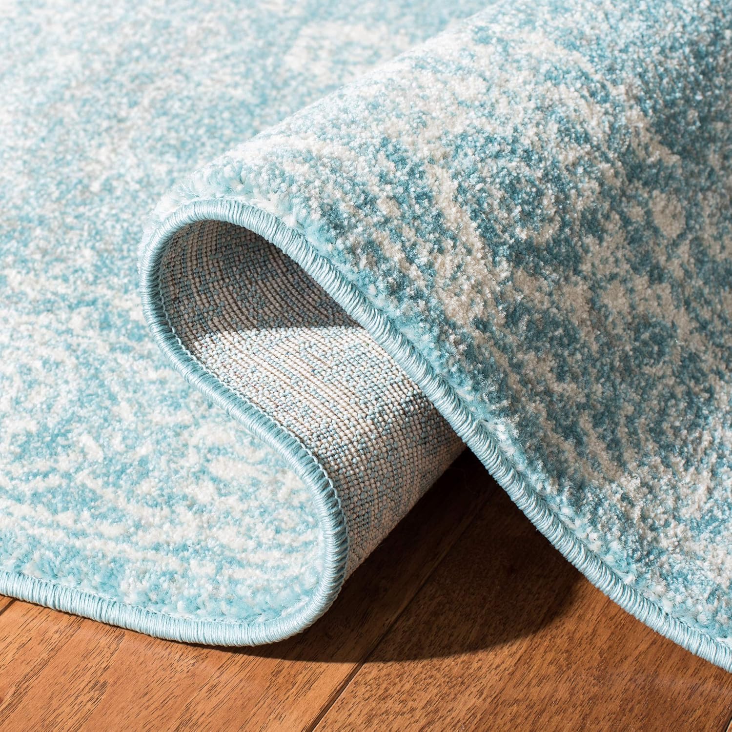 SAFAVIEH Evoke Collection Area Rug - 9' x 12', Light Blue & Ivory, Shabby Chic Distressed Design, Non-Shedding & Easy Care, Ideal for High Traffic Areas in Living Room, Bedroom (EVK270D)