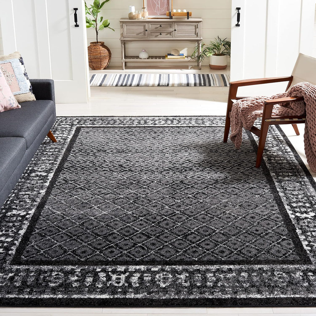 SAFAVIEH Adirondack Collection Area Rug - 9' x 12', Black & Silver, Distressed Design, Non-Shedding & Easy Care, Ideal for High Traffic Areas in Living Room, Bedroom (ADR110A)