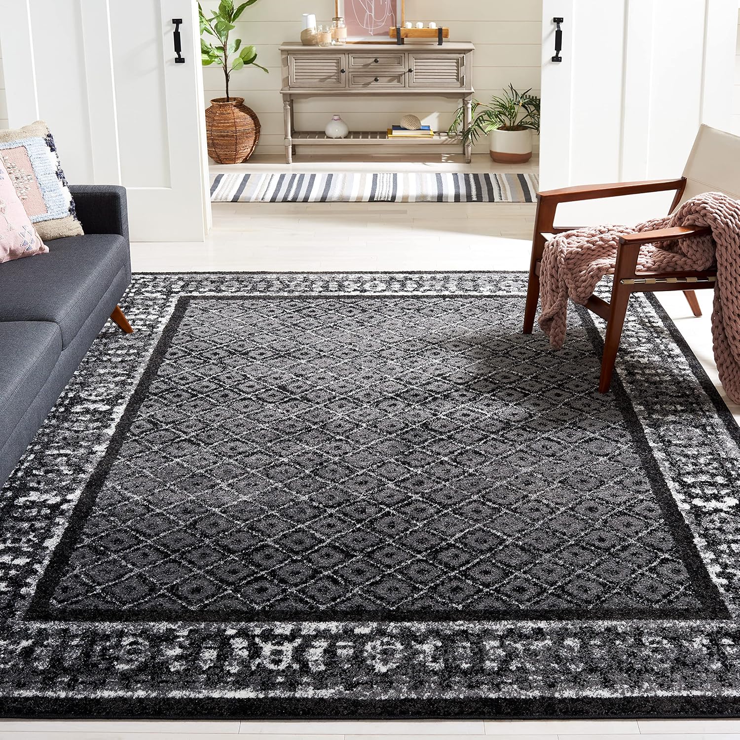 SAFAVIEH Adirondack Collection Area Rug - 9' x 12', Black & Silver, Distressed Design, Non-Shedding & Easy Care, Ideal for High Traffic Areas in Living Room, Bedroom (ADR110A)