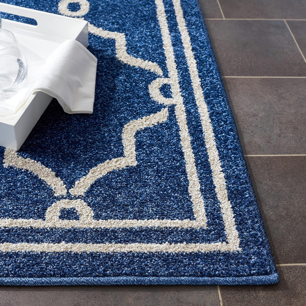 SAFAVIEH Amherst Collection Area Rug - 9' x 12', Navy & Beige, Trellis Design, Non-Shedding & Easy Care, Ideal for High Traffic Areas in Living Room, Bedroom (AMT414P)